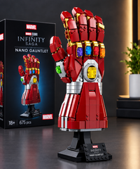 Marvel Infinity Saga Nano Gauntlet displayed on a black stand.
Detailed red, gold, silver, and colorful Infinity Stones design.
Premium collectible display model for Marvel fans.
Ideal for home, office, or gaming room decoration.