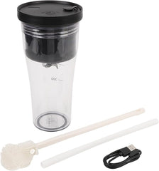 Clear travel mug with black lid, USB cable, and cleaning brush on a white background