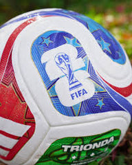 Colorful soccer ball with FIFA logo and Trinida brand name on a blurred background