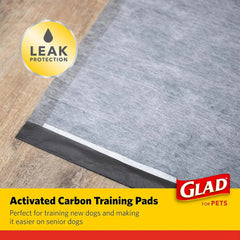 Glad charcoal puppy pads showing absorbent layers for dog pee and odor control.