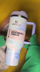 Stanley Quencher H2O tumbler with colorful design on a yellow background