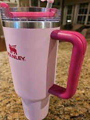 Stanley mug with handle on a countertop