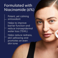 Woman applying cream to her face with text about niacinamide benefits 