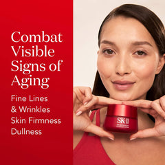 Woman holding an SK-II skincare product with text on visible signs of aging.