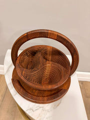 Wooden basket with handles on a marble surface