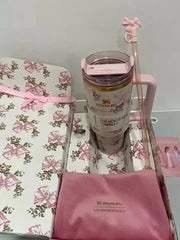  floral-patterned mug with matching towel on a light gray background